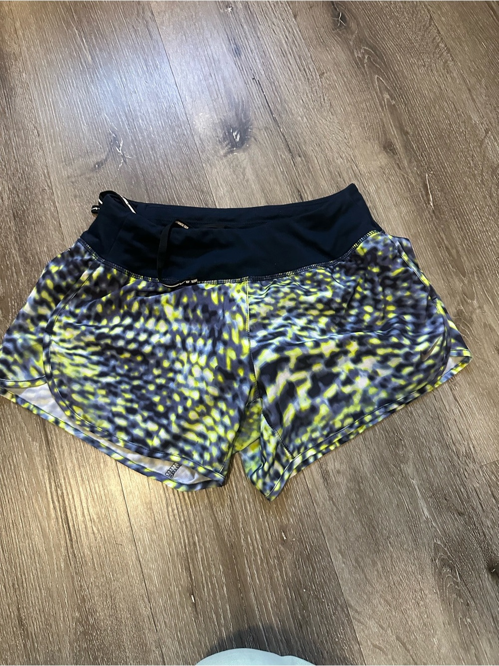 Nike Women’s blue Waistband Athletic Shorts with Yellow-Print Pattern